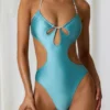 Melo Melo halternekbadpak met parelversiering en uitsnijdingen in turquoise