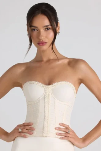 Melvina gerimpelde, strikbare strapless korset-top in ivoor