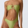 Miami bandeau-badpak met uitsnijdingen en kralenversiering in perengroen