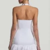 Millie minijurk met strikdetail, halternek en bolle zoom in wit