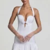 Millie minijurk met strikdetail, halternek en bolle zoom in wit