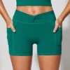 Mini-short met gedraaide tailleband en zakken in blauwgroen