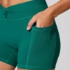 Mini-short met gedraaide tailleband en zakken in blauwgroen