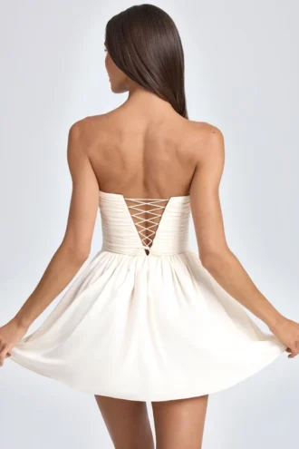 Mirabelle bandeau minijurk met bloemenapplicaties in ivoor