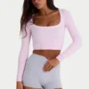 Naadloze, zacht geribde crop top met uitsnijdingen in poederroze