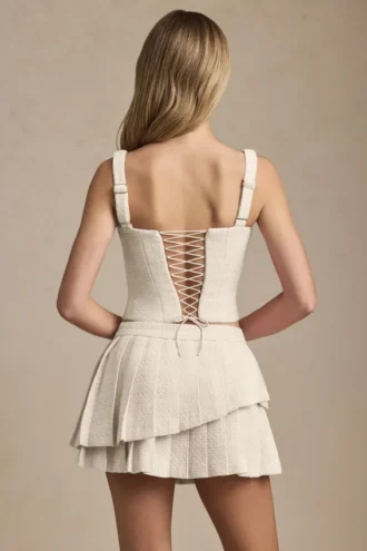 Nada gelaagde geplooide minirok met lage taille in ivoor