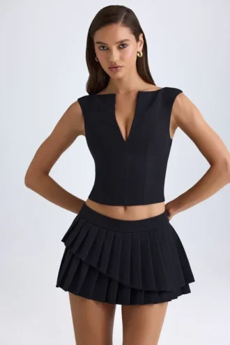 Nada gelaagde geplooide minirok met lage taille in zwart