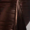 Nasira minijurk van metallic jersey met uitsnijdingen in koperbrons
