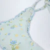Nieva stringbikini met strikjes aan de zijkant in blauw bloemenmotief