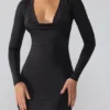 Oakley Slinky Jersey minijurk met lange mouwen en diep decolleté in zwart