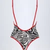 Ostend badpak met kruisrug en bedeltjes in zebraprint