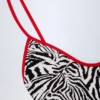 Ostend badpak met kruisrug en bedeltjes in zebraprint