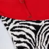 Ostend badpak met kruisrug en bedeltjes in zebraprint