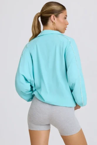 Oversized trainingsjack in aqua