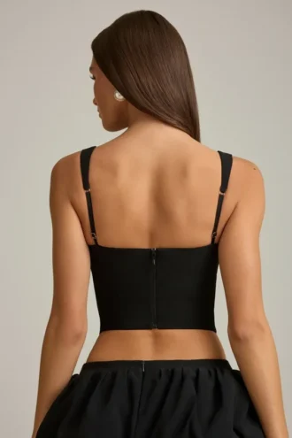 Pearla korset-top met uitsnijdingen en strikdetail in zwart