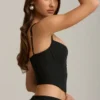 Pearla korset-top met uitsnijdingen en strikdetail in zwart
