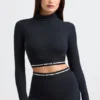 Rugloze crop top met col en lange mouwen in zwart
