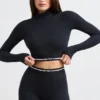 Rugloze crop top met col en lange mouwen in zwart