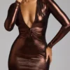 Safiya avondjurk met lange mouwen van metallic jersey in koperbrons