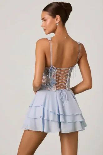 Sakura minijurk met versierde ruches en korset in bloemenblauw