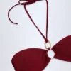 Savai bikinitop met halternek en ruches en metalen details in Dark Cherry