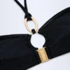 Savai bikinitop met halternek en ruches en metalen details in zwart