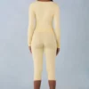 Selene gebreide capribroek met middelhoge taille in botergeel