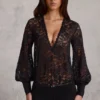 Serenya doorschijnende kanten Playsuit met diepe halslijn en losse pasvorm in zwart