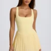 Soft Active tennisjurk met open rug en plooien in Lemon