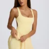 Soft Active tennisjurk met open rug en plooien in Lemon