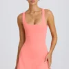 Soft Active tennisjurk met open rug in koraal