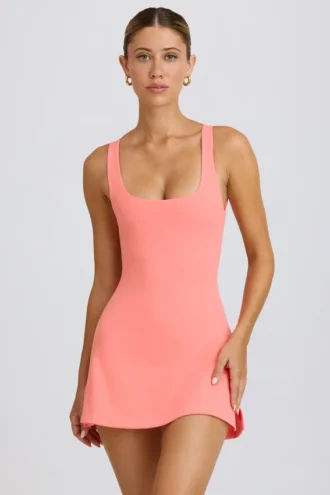 Soft Active tennisjurk met open rug in koraal