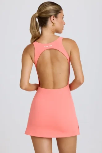 Soft Active tennisjurk met open rug in koraal
