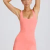 Soft Active tennisjurk met open rug in koraal