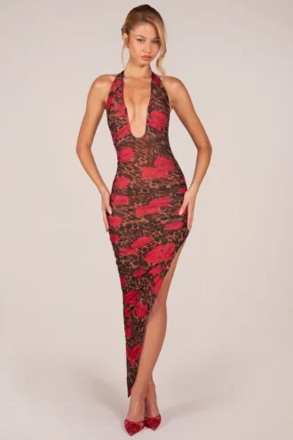 Storie halterjurk met split aan de zoom en halflange lengte in roze luipaardprint
