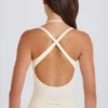 Stretch katoenen jersey body met gelaagde kruisrug in crème
