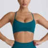 Super Sculpt naadloze sportbeha met gekruiste bandjes in blauwgroen