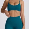 Super Sculpt naadloze sportbeha met gekruiste bandjes in blauwgroen