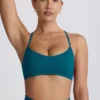 Super Sculpt naadloze sportbeha met gekruiste bandjes in blauwgroen