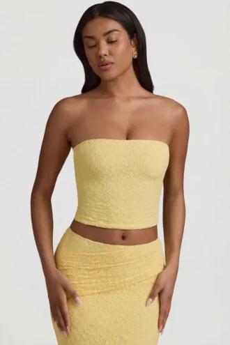 Tamia gerimpelde strapless kanten top in pastelgeel