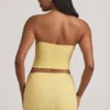 Tamia gerimpelde strapless kanten top in pastelgeel