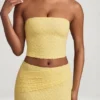 Tamia gerimpelde strapless kanten top in pastelgeel