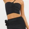 Tesia Slinky Jersey asymmetrische top met rozenmotief in zwart