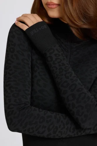 Thermische jumpsuit in zwart met luipaardprint