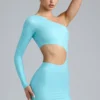 Zanab metallic minijurk met uitsnijdingen en één schouder in ijsblauw