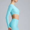 Zanab metallic minijurk met uitsnijdingen en één schouder in ijsblauw